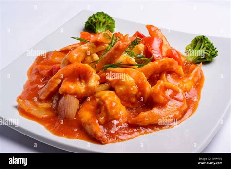 Shrimp In Tomato Sauce On A White Square Plate Closeup Chinese Food