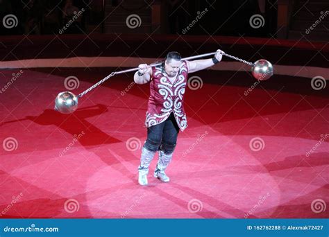 Strong Man Showing Tricks With Weights On Arena Of Circus Editorial