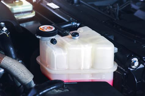 Leaking Coolant Reservoir Symptoms And Replacement Cost In The Garage With