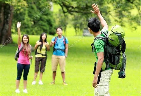 Young man with friends camping in the park — Stock Photo © odua #39032353