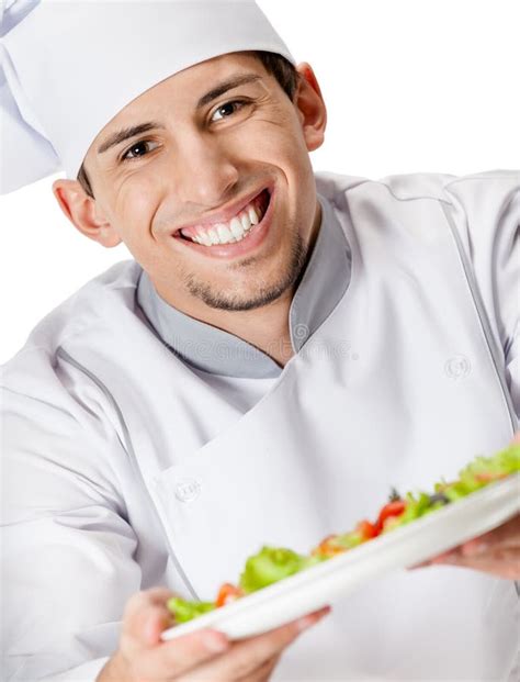 Portrait Of Chef Cook Offering Salad Dish Royalty Free Stock Images