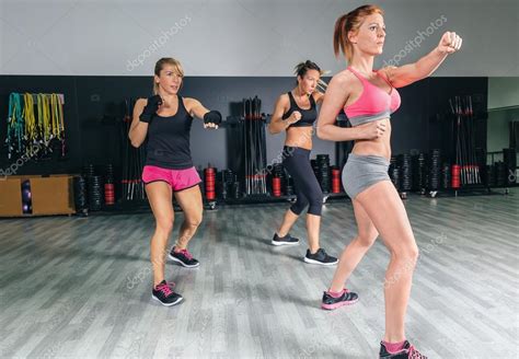 Women in a boxing class training punch — Stock Photo © doble.dphoto ...