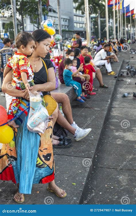 Many Cambodian People Gather At Sunset Along Phmom Penh S Riverside