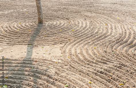 Simple spiritual patterns in a Japanese Zen Garden with lines raked Sand, Karesansui. Stock