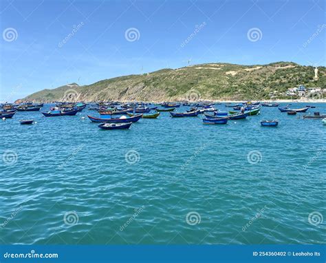 Fishing Boats Are Anchored At The Pier In The Morning On The Blue