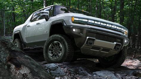 Underside view of GMC Hummer EV off road in forest - ERNIE DEAN CHEVROLET BUICK GMC LTD