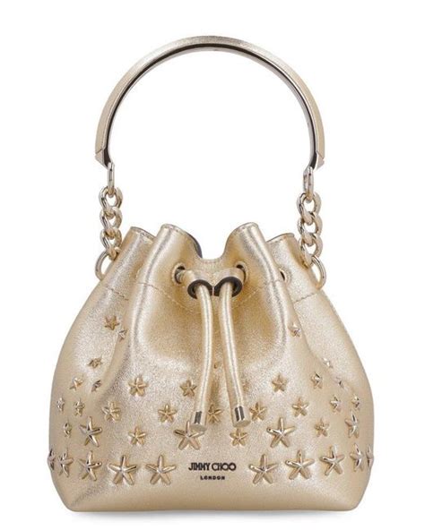 Jimmy Choo Leather Bon Bon Logo Detailed Bucket Bag In Gold Metallic