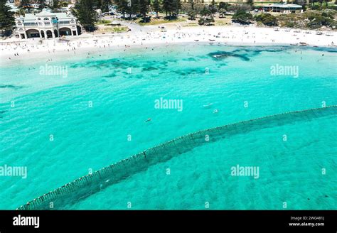 People Swimming And Sunbathing On The Beach At Cottesloe Beach Perth