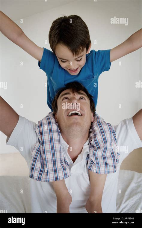 Portrait Of A Father And Son Playing Stock Photo Alamy