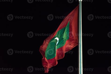 Maldives Flag While Weaving At Night Stock Photo At Vecteezy