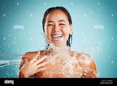 Happy Water Splash And Woman In Studio For Skincare Cleaning And