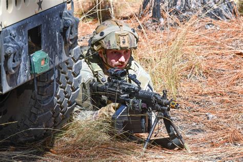 Combat medics use M249 light machine gun during field observational ...