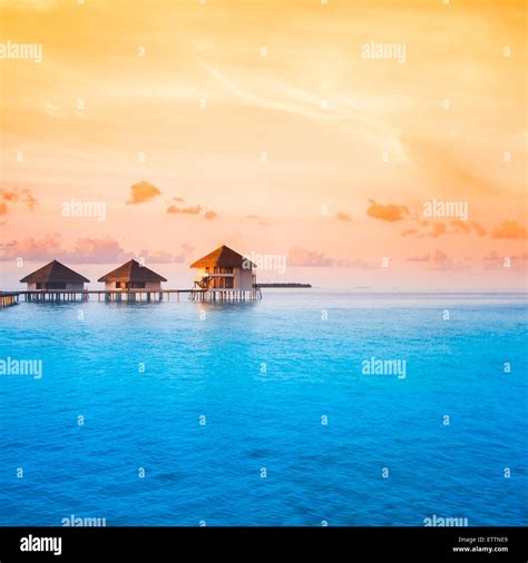 Sunset on Maldives island Stock Photo - Alamy