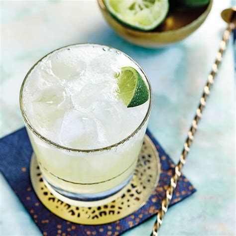 Tequila Slammer | sheerluxe.com Tequila Drinks, Cocktails, Old Fashioned Glass, Lime Wedge ...