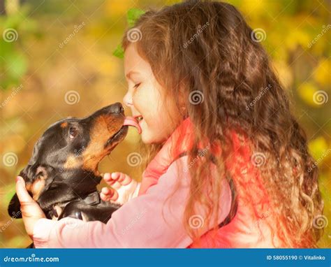 Child and Dog Embracing and Kissing. Stock Photo - Image of care ...