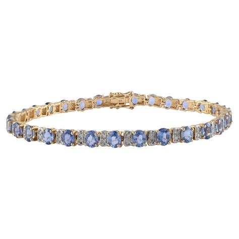 Tennis Bracelet With Blue Sapphire And Diamonds Set In Solid K Yellow