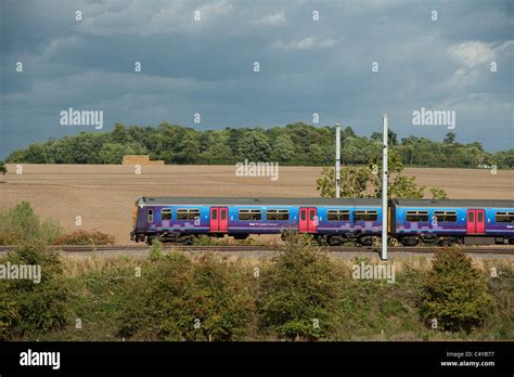 Class 319 Train In First Capital Connect Livery Travelling Through The