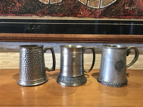 Three Pewter Mugs - Shapiro Auctioneers