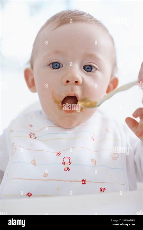 Kid eating mouth open wide hi-res stock photography and images - Alamy