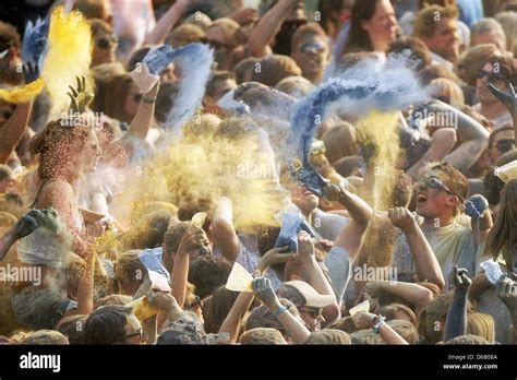 People Throw Coloured Powders To Celebrate A Holi Festival In