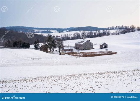 View Of A Snow Covered Farm And Rolling Hills Near Shrewsbury Stock