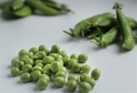 Premium Photo Fresh Green Peas In A Pod And With Peas