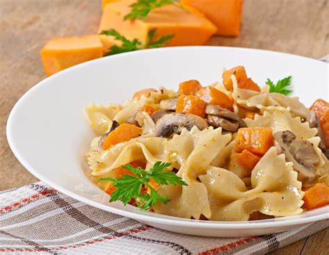 Premium Photo Pasta In Cream Sauce With Slices Of Pumpkin And Mushroom