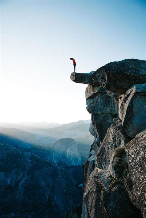 Man Standing On Cliff Overlooking Yosemite Stock Photo At Vecteezy