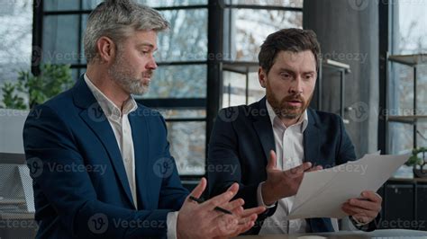 Nervous angry man boss argue scolds employee because mistake in