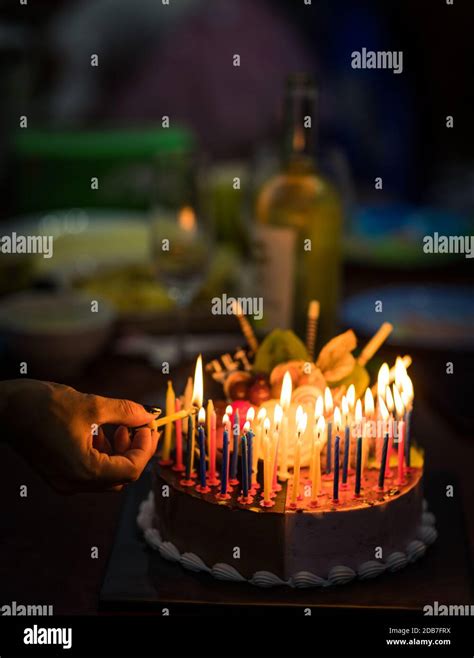 Birthday cake with candles in dark Stock Photo - Alamy