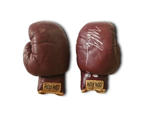 Mike Tyson Signed Boxing Gloves - CharityStars