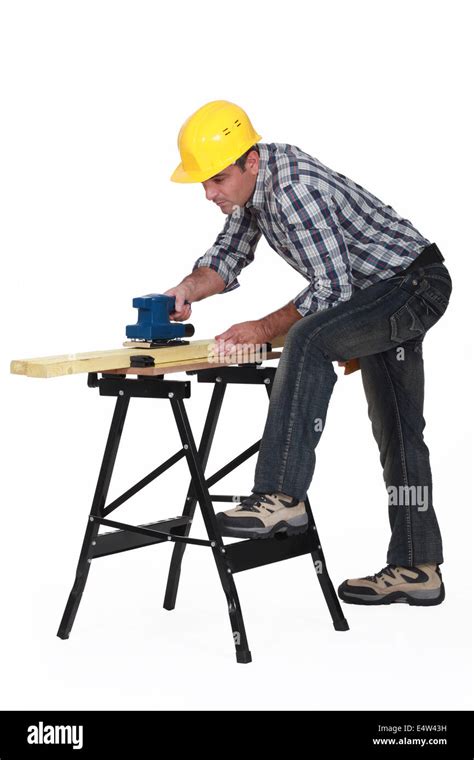 Carpenter Using An Electric Sander Stock Photo Alamy