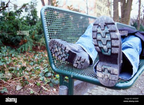 Homeless Man Sleeping On Bench Hi Res Stock Photography And Images Alamy