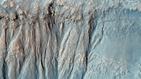 Gullies And Layers In A Crater Near Mariner Crater Mars From Space