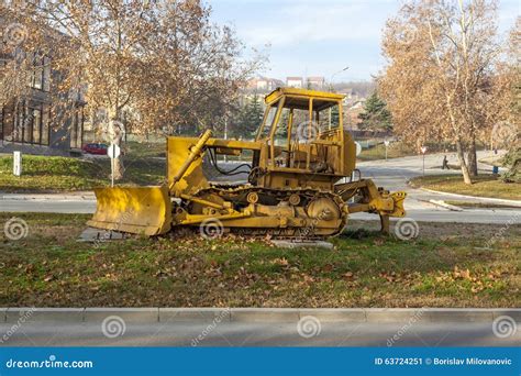 Yellow Buldozer Or Excavator Performs Earthwork Ground Level Layout