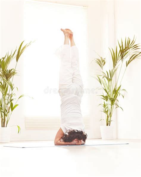 woman  supported headstand  sirsasana pose  practicing yoga