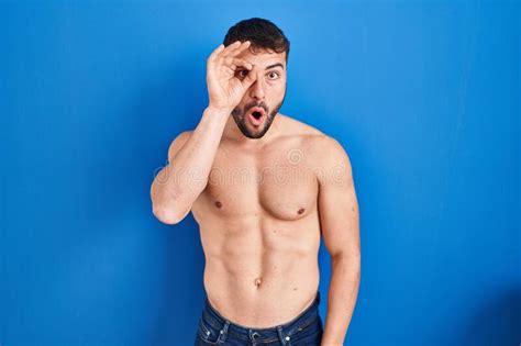 Handsome Hispanic Man Standing Shirtless Doing Ok Gesture Shocked With