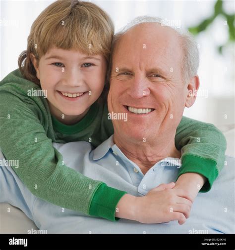 Grandfather And Grandson Hugging Stock Photo Alamy