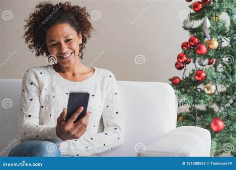 Cheerful Woman Holding Mobile Phone On Christmas Holiday Stock Image Image Of Happy Comfort