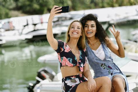 Two Happy Young Women Taking A Selfie At Marina In Summer 30340682