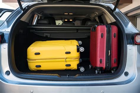 Premium Photo Trunk Of Suv Car Loaded With Travel Luggage Or Baggage