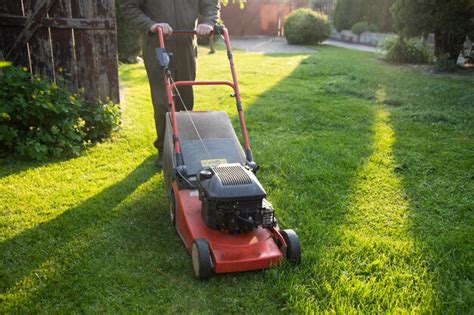 Premium Photo Lawn Mover On Green Grass Machine For Cutting Lawns