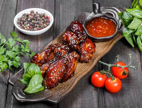 Barbecue Chicken Wings With Bbq Sauce On Plate On Wooden Background Stock Image - Image of ...