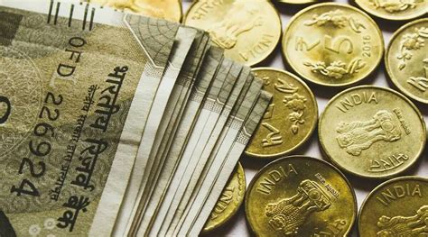 Rupee Gains Paise To Close At Against Us Dollar Business