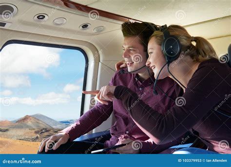 Couple on Vacation Taking Ride in Helicopter Stock Image - Image of female, transportation ...