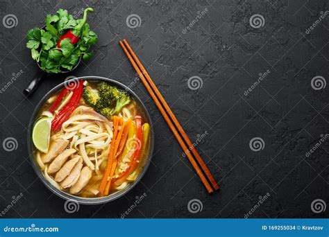 Chicken Thukpa in Black Bowl at Dark Slate Background. Chicken Thukpa is Tibetan Cuisine Noodle ...