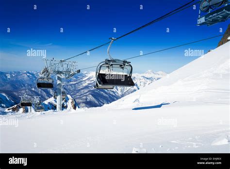 Ski Chairlift Over Mountains On Winter Resort Stock Photo Alamy