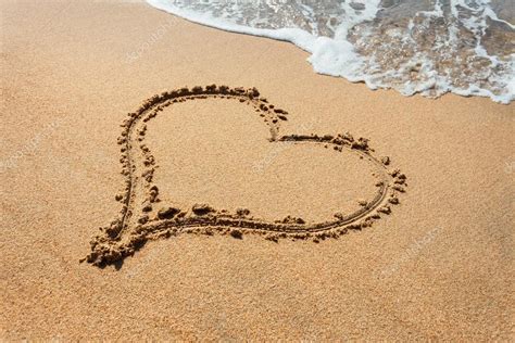 Beautiful Heart Shape In The Beach Sands Stock Photo By Rasica