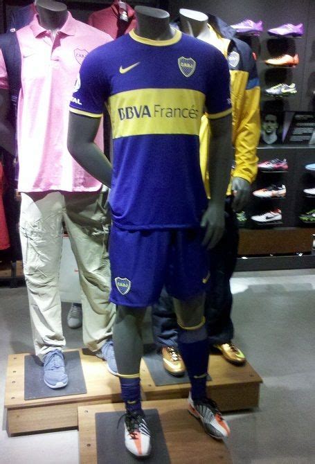 Mannequins Dressed In Blue And Yellow Uniforms Are On Display At The Store