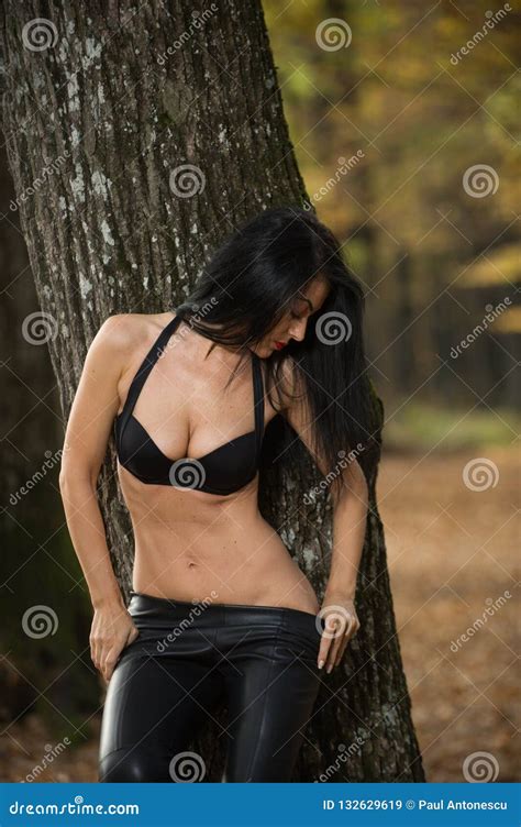 Beautiful Dark Haired Young Woman Wearing A Black Bra Leather Jacket